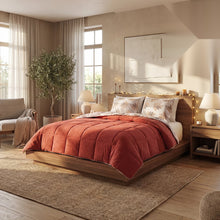 HELDENA Wellsoft Bettdecke Orange auf dem Bett